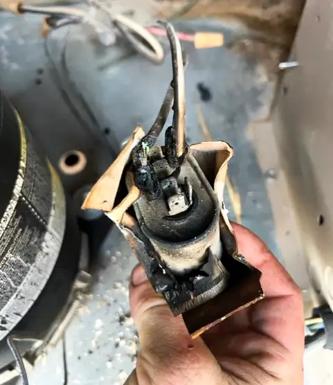 A burned up part in an HVAC we are repairing.