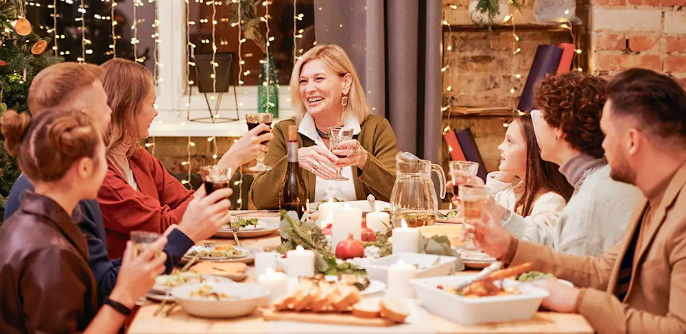 A family gathers around the holiday feast.